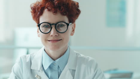 Portrait-of-Joyous-Female-Doctor-in-Clinic